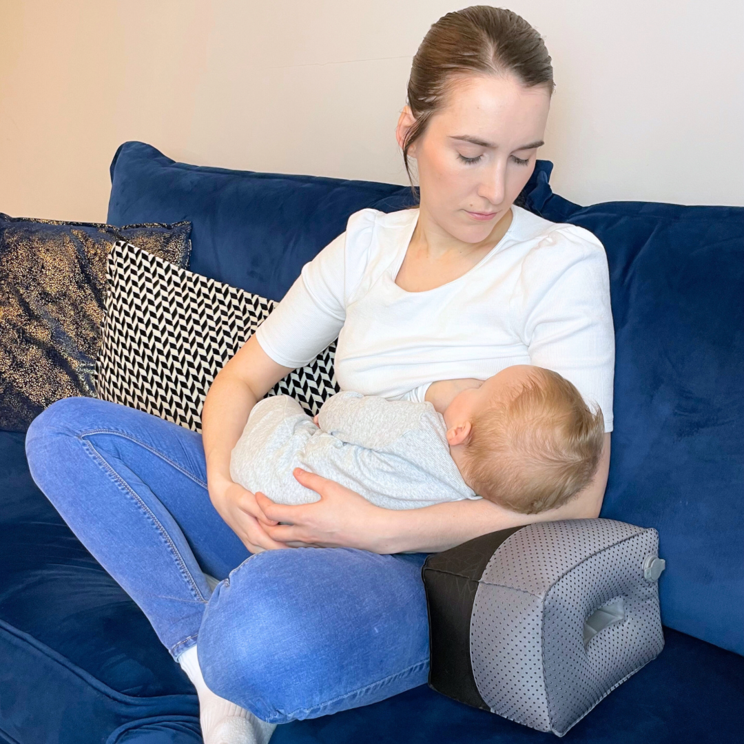Breastfeeding Pillow-Mother Breastfeeding Using Nursing Pillow Black in Colour-Side Angle Showing Handle