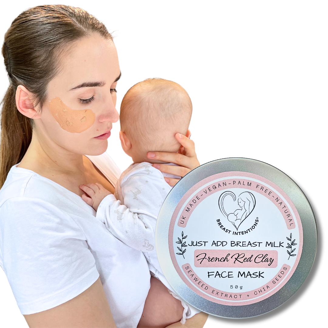 Breastfeeding mum using face mask and holding baby