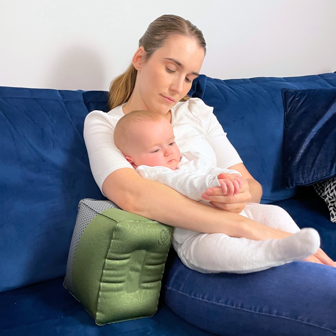 Breastfeeding Pillow- Mother Relaxing with Baby Using Nursing Pillow Green in Colour for Support-Showing Pillow at Largest Height